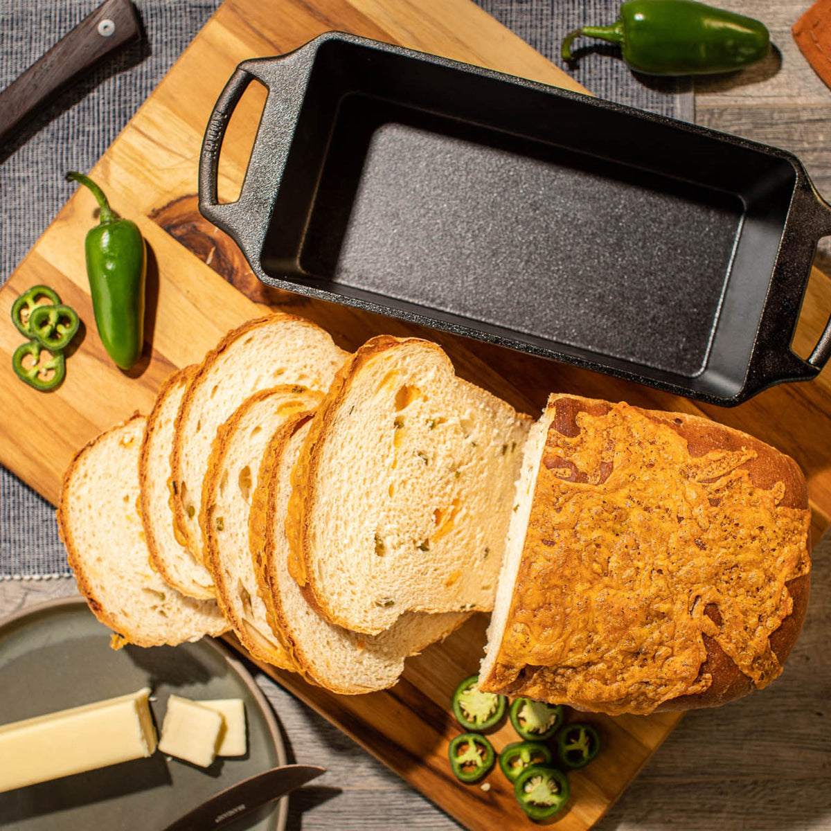 Lodge classic black bread proofing basket with oval shape and woven design for artisan baking.