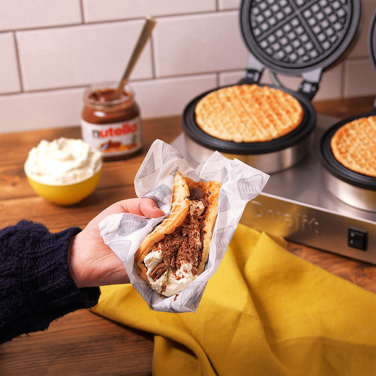Polished DUALIT contact waffle iron for catering, showing the shiny, professional stainless steel surface and waffle plates.