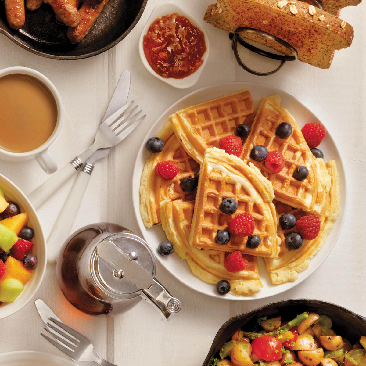 Polished DUALIT contact waffle iron for catering, with stainless steel finish and multiple waffle plates visible in the image.