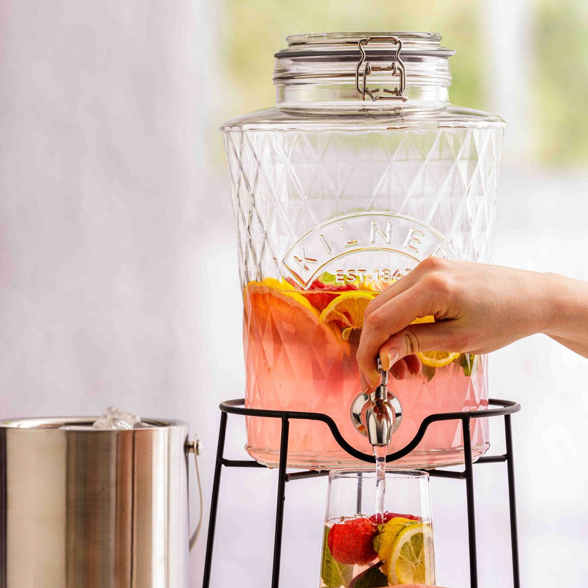 KILNER Diamond beverage dispenser with a clear glass body and metal spigot, designed for serving drinks at gatherings.