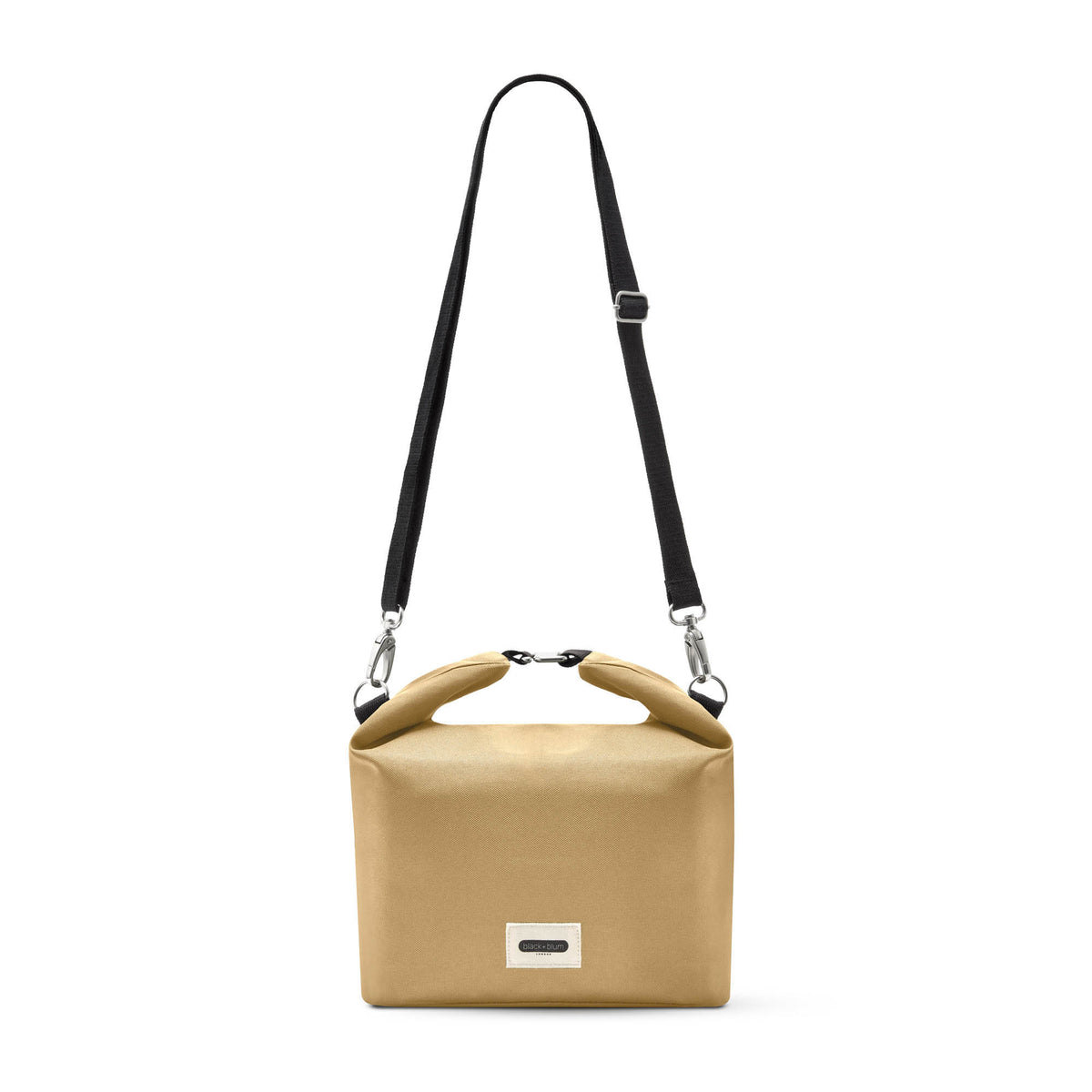 BLACK+BLUM insulated lunchbag with black exterior and adjustable strap, designed to keep food fresh and portable.