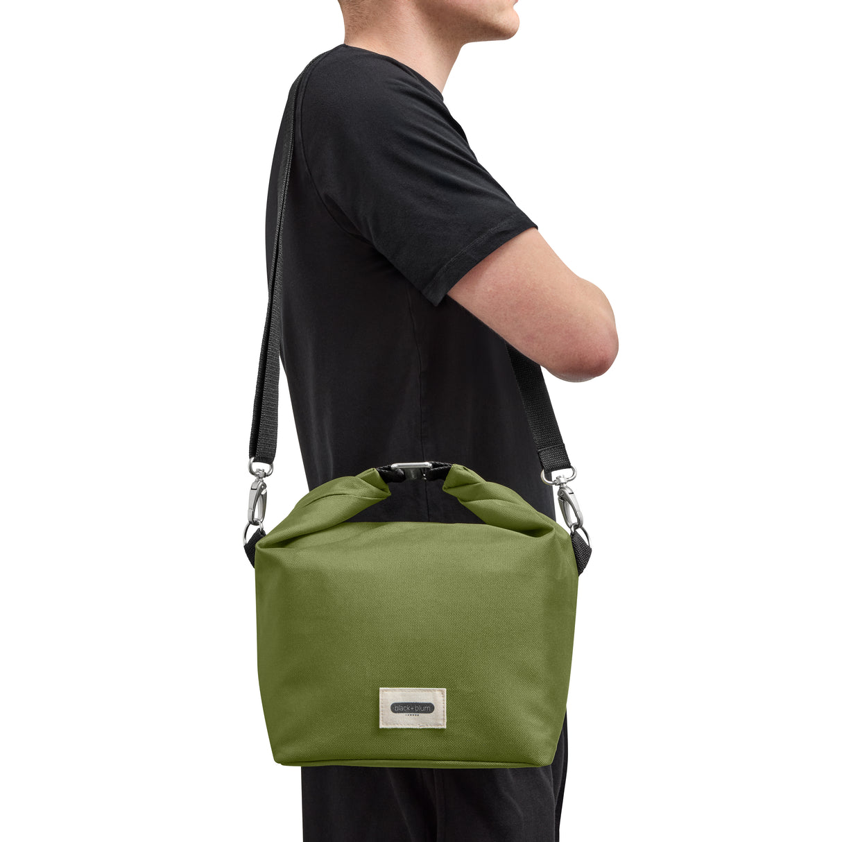 Black+Blum insulated lunch bag with short handle in moss green, featuring a compact design for carrying lunch easily.