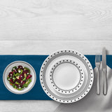 White CORELLE City Block dinnerware set with plates and bowls arranged on a table, showcasing durable ceramic design.