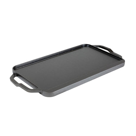 Lodge 2-sided grill plate with smooth and ridged surfaces, 50.8 cm x 25.4 cm, designed for versatile outdoor cooking.