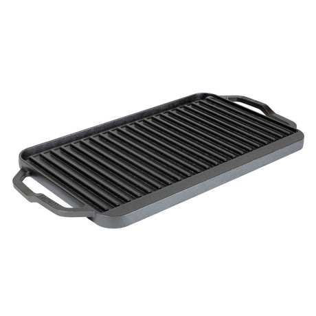 Lodge 2-sided grill plate with smooth and ridged surfaces, 50.8 cm x 25.4 cm, ideal for grilling and searing.