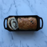 Lodge classic black bread proofing basket with a woven design for bread baking and dough rising.