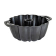 Black LODGE classic cake pan with a smooth, non-stick surface and sturdy construction for baking delicious cakes.
