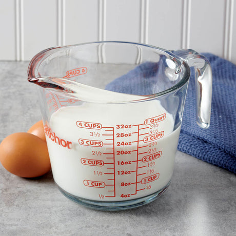 Anchor Hocking glass measuring cup with measurement markings for accurate liquid and ingredient measurement.