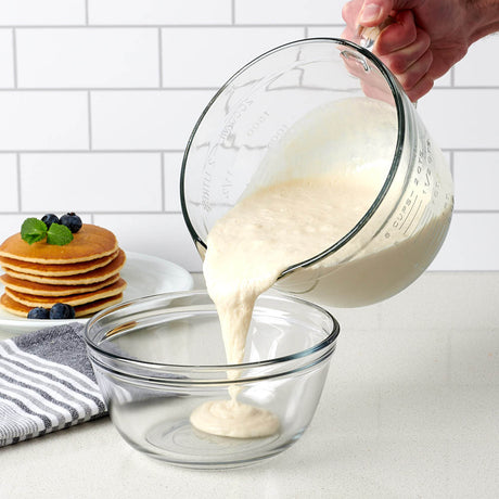 Anchor Hocking 2L measuring cup with clear glass body and measurement markings for precise liquid measuring.