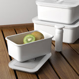 HONEYWARE white enameled vacuum canister with a 2.8L capacity, sleek design, and secure lid for food storage