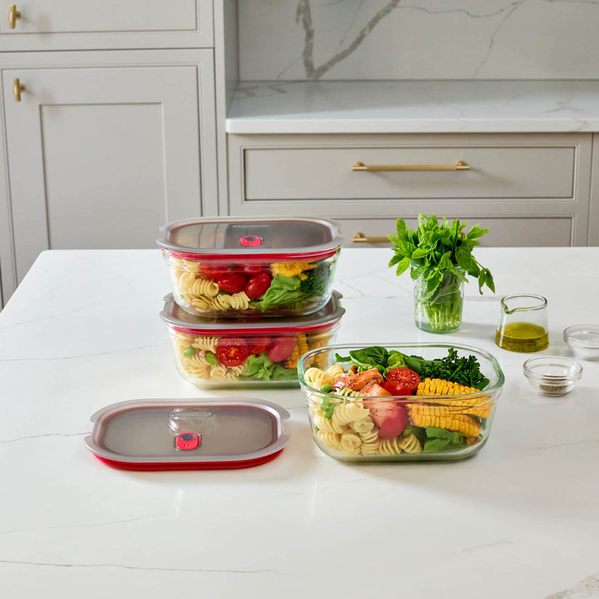 BLACK+BLUM multifunction glass storage jars in a 3-piece set, with clear lids and sleek design for kitchen organization.