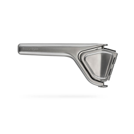 DREAMFARM stainless steel juice press (Saftpresse) with ergonomic handle and durable construction for fresh juice extraction.